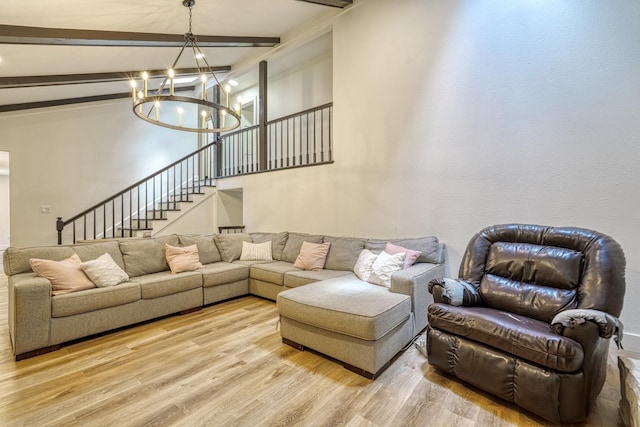 236 Heathwood Dr, Spartanburg, SC 29307 - living area with wood finished floors, a chandelier, beam ceiling, and stairs