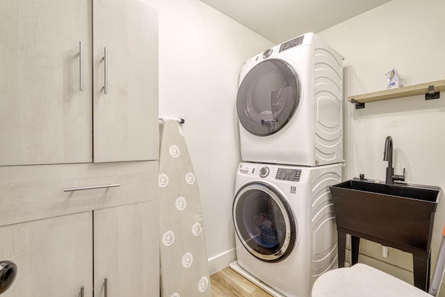236 Heathwood Dr, Spartanburg, SC 29307 - washroom featuring stacked washing machine and dryer and light wood-style floors