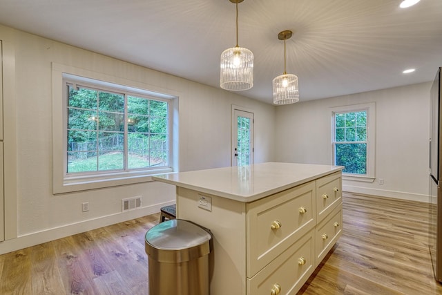236 Heathwood Dr, Spartanburg, SC 29307 - kitchen with light wood-style flooring, light countertops, a center island, decorative light fixtures, and recessed lighting