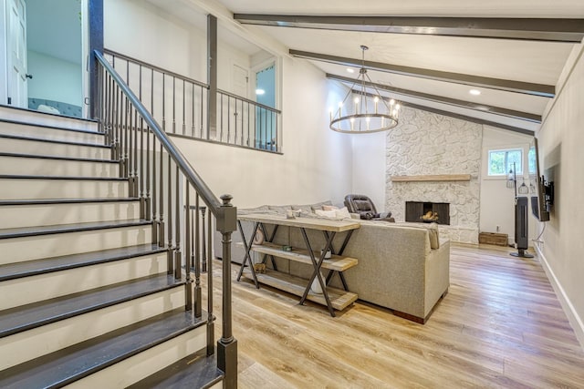236 Heathwood Dr, Spartanburg, SC 29307 - living area with light wood-type flooring, stairs, a stone fireplace, and a chandelier