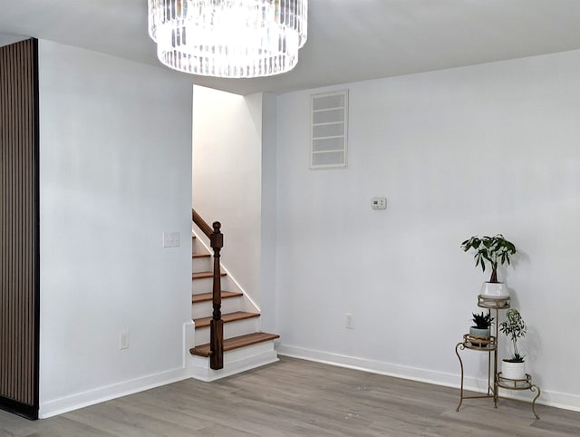 2115 Oakhurst Cir, Spartanburg, SC 29302 - staircase featuring wood finished floors and a chandelier