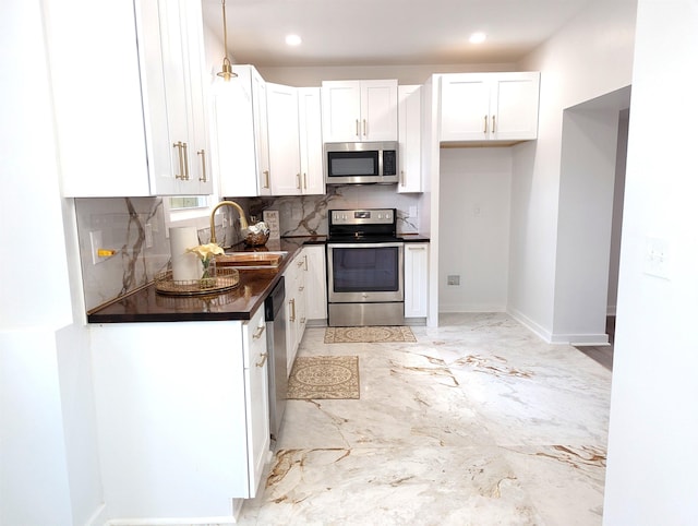 2115 Oakhurst Cir, Spartanburg, SC 29302 - kitchen with stainless steel appliances, dark countertops, decorative backsplash, white cabinetry, and recessed lighting