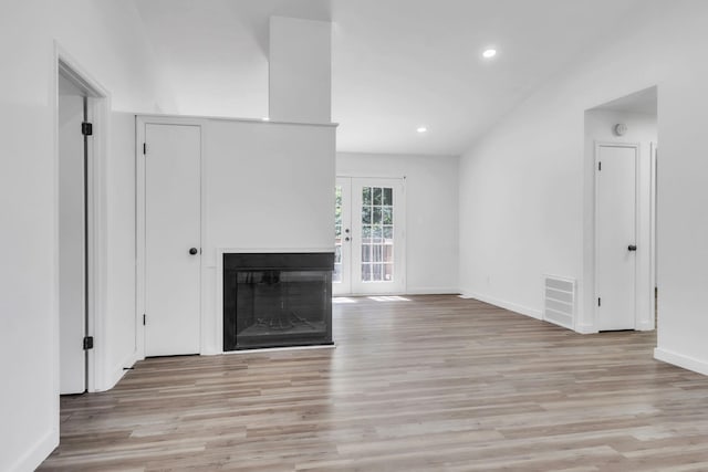 339 Crestview Dr, Spartanburg, SC 29306 - unfurnished living room featuring light wood-style floors, a fireplace, recessed lighting, and vaulted ceiling
