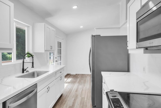 339 Crestview Dr, Spartanburg, SC 29306 - kitchen with stainless steel appliances, healthy amount of natural light, white cabinets, light stone counters, and recessed lighting