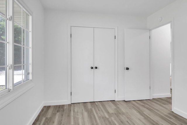 339 Crestview Dr, Spartanburg, SC 29306 - unfurnished bedroom with light wood-type flooring and a closet