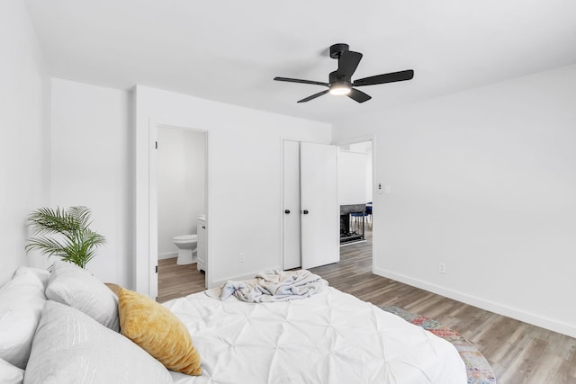 339 Crestview Dr, Spartanburg, SC 29306 - bedroom with wood finished floors, connected bathroom, and a ceiling fan