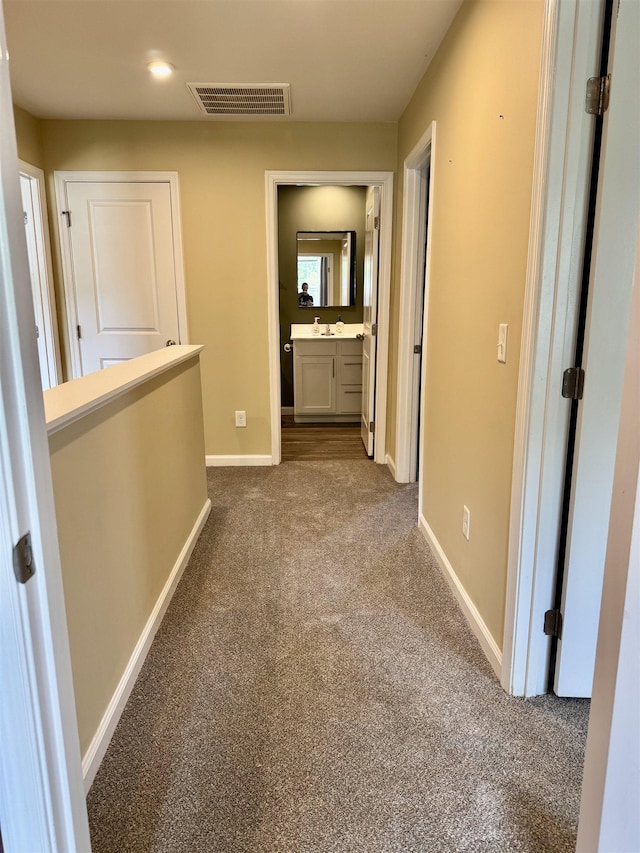171 Ralston Rd, Greer, SC 29351 - hallway featuring dark colored carpet and baseboards