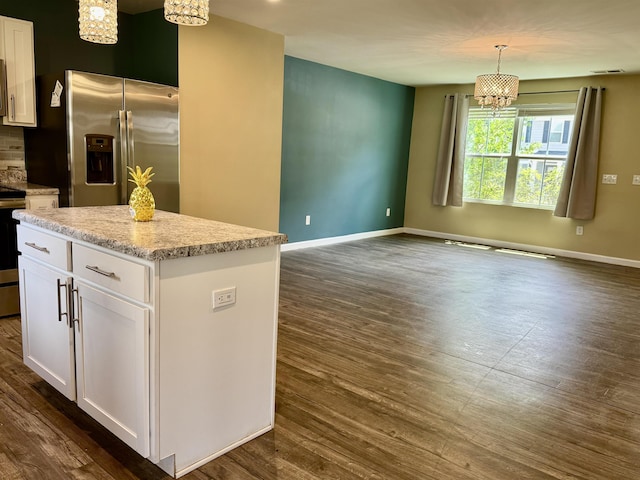 171 Ralston Rd, Greer, SC 29351 - kitchen featuring stainless steel appliances, a chandelier, dark wood finished floors, white cabinetry, and decorative light fixtures