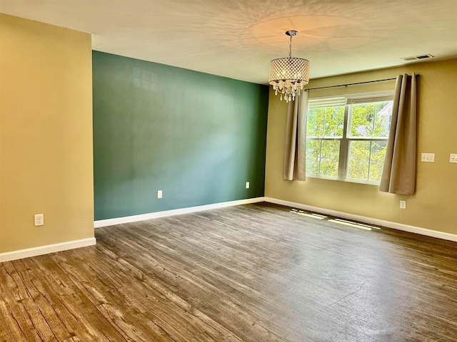 171 Ralston Rd, Greer, SC 29351 - unfurnished room featuring a chandelier and wood finished floors