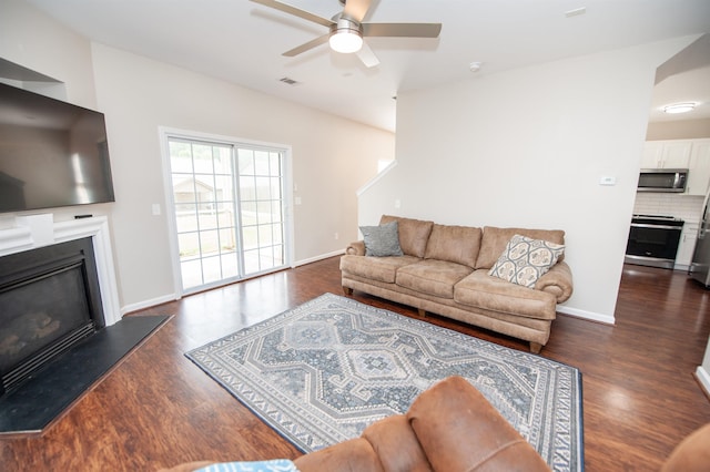 363 Robin Helton Dr, Boiling Springs, SC 29316 - living room featuring a glass covered fireplace, a ceiling fan, and dark wood-style flooring