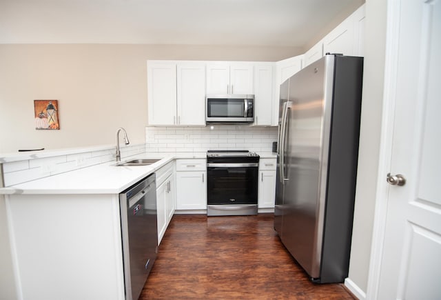 363 Robin Helton Dr, Boiling Springs, SC 29316 - kitchen featuring stainless steel appliances, decorative backsplash, dark wood-style floors, and white cabinets
