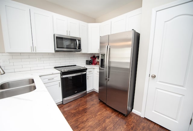 363 Robin Helton Dr, Boiling Springs, SC 29316 - kitchen with appliances with stainless steel finishes, tasteful backsplash, dark wood-style flooring, and white cabinets
