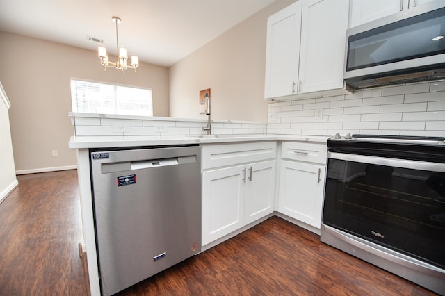 363 Robin Helton Dr, Boiling Springs, SC 29316 - kitchen with stainless steel appliances, a peninsula, backsplash, and dark wood-style flooring