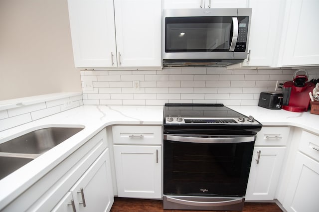 363 Robin Helton Dr, Boiling Springs, SC 29316 - kitchen featuring appliances with stainless steel finishes, backsplash, white cabinets, and light stone counters