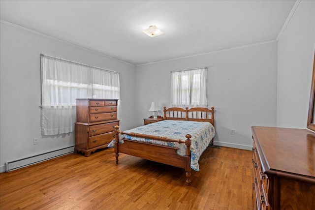 2160 Compton Bridge Rd, Inman, SC 29349 - bedroom with ornamental molding, a baseboard heating unit, and light wood-type flooring