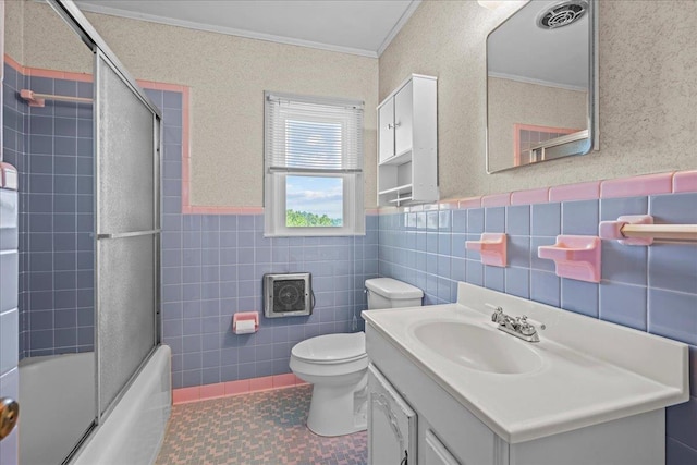 2160 Compton Bridge Rd, Inman, SC 29349 - bathroom featuring ornamental molding, vanity, tile walls, bath / shower combo with glass door, and a wainscoted wall