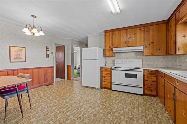 2160 Compton Bridge Rd, Inman, SC 29349 - kitchen featuring white appliances, brown cabinetry, a chandelier, light countertops, and crown molding