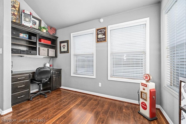 home office featuring lofted ceiling and dark hardwood / wood-style floors