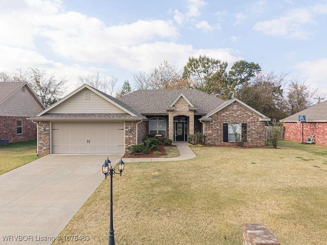 ranch-style house featuring a front lawn and a garage