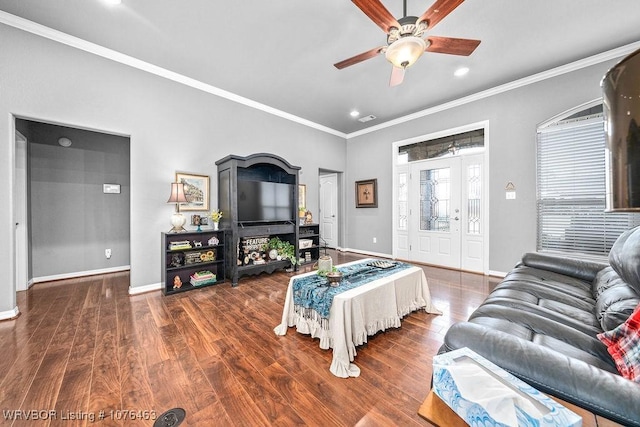 living room featuring ceiling fan, ornamental molding, and dark wood-type flooring