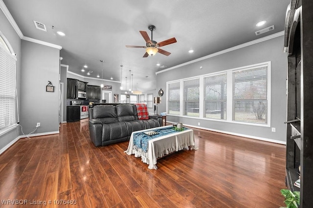 living room featuring ceiling fan, dark hardwood / wood-style flooring, and ornamental molding