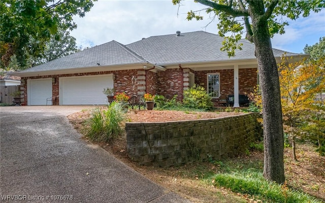 ranch-style house featuring a garage