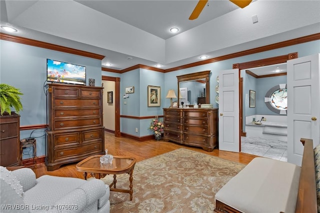 living area with ceiling fan, crown molding, and light wood-type flooring