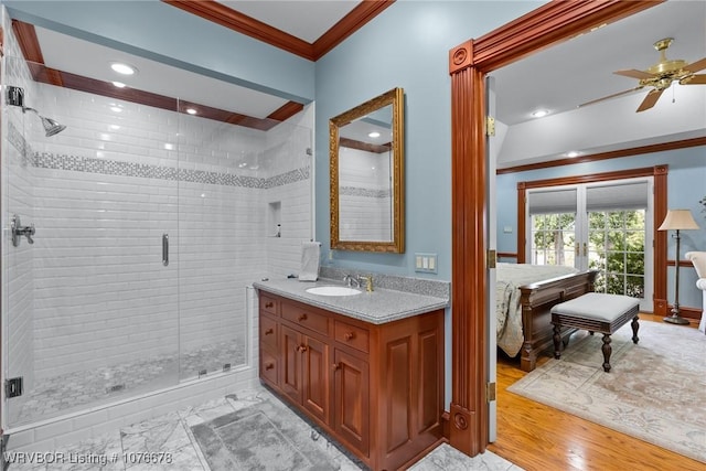 bathroom with ceiling fan, french doors, walk in shower, wood-type flooring, and ornamental molding