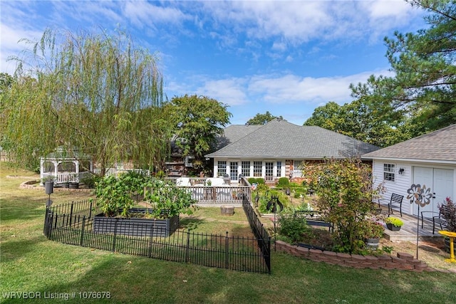 rear view of house with a lawn