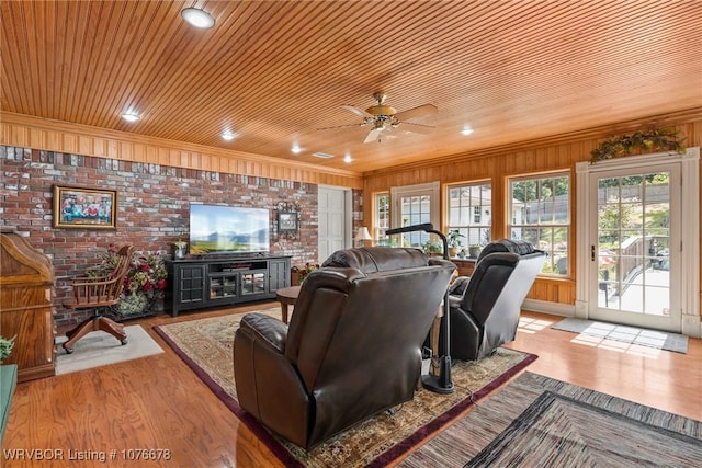 living room with brick wall, light hardwood / wood-style flooring, ceiling fan, and wood ceiling