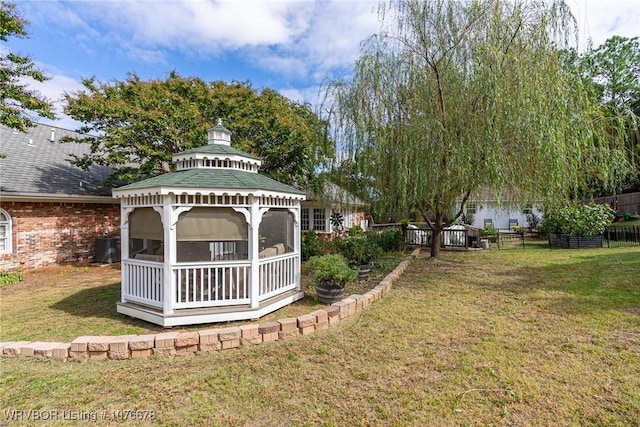 view of yard with a gazebo and central air condition unit