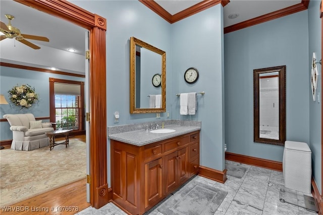 bathroom with vanity, ceiling fan, and ornamental molding