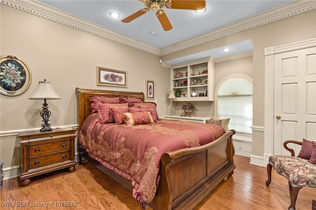 bedroom with ceiling fan, light wood-type flooring, and ornamental molding