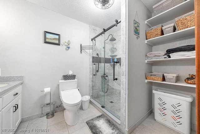 bathroom featuring tile patterned floors, toilet, an enclosed shower, and a textured ceiling