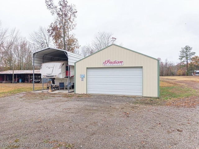 garage featuring a carport