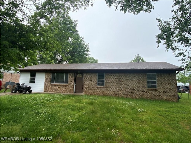 614 N School St, Charleston, AR 72933 - ranch-style house featuring a front yard and brick siding