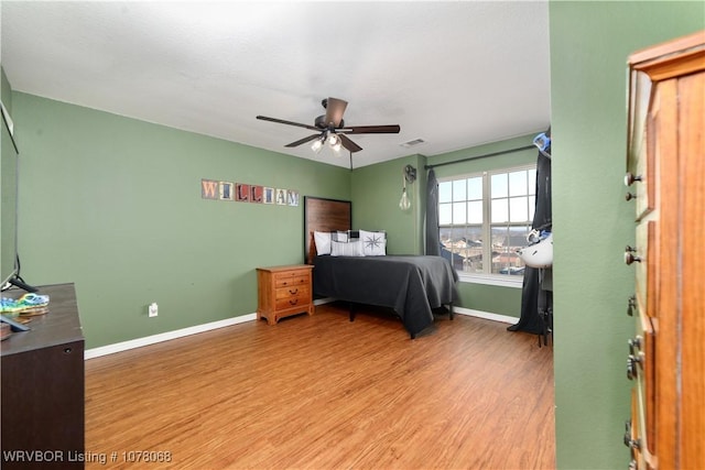 bedroom featuring ceiling fan and light hardwood / wood-style floors