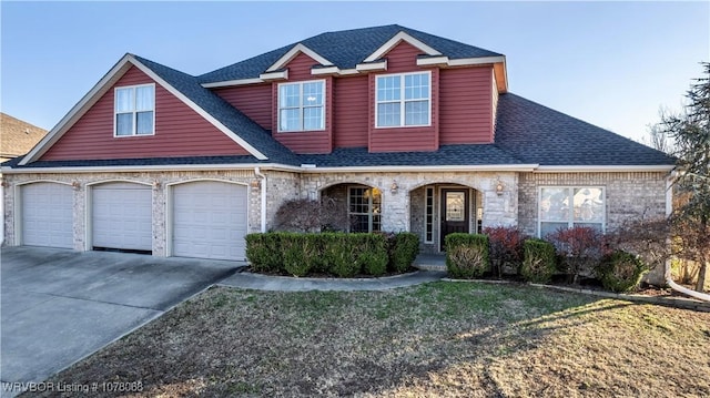 view of front of home featuring covered porch and a garage