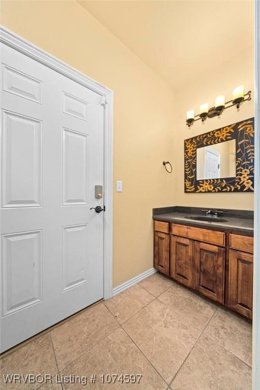 bathroom with tile patterned flooring and vanity