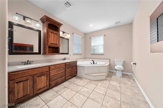 bathroom featuring a tub to relax in, tile patterned flooring, vanity, and toilet