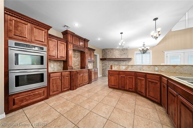 kitchen with tasteful backsplash, double oven, decorative light fixtures, an inviting chandelier, and light tile patterned flooring