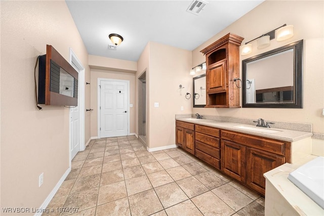 bathroom featuring tile patterned flooring and vanity