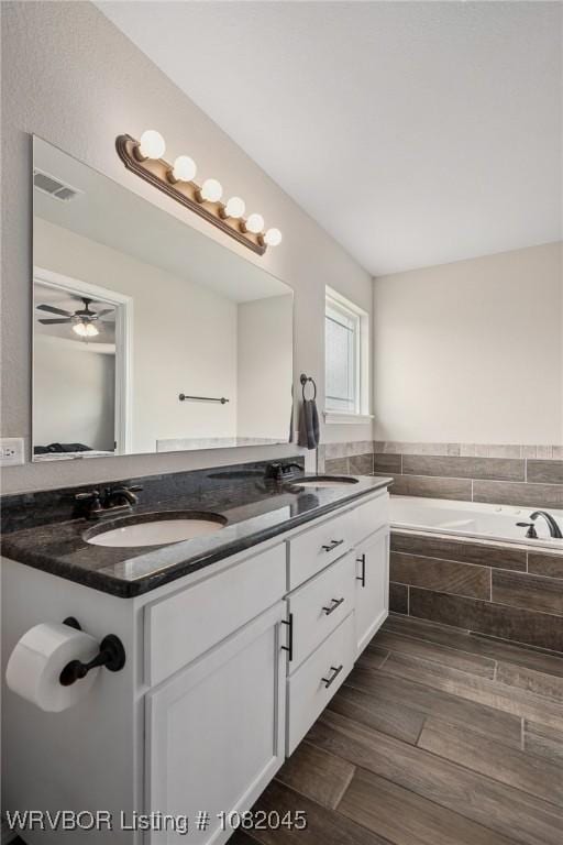 1138 Delta Dr, Van Buren, AR 72956 - bathroom with a garden tub and double vanity