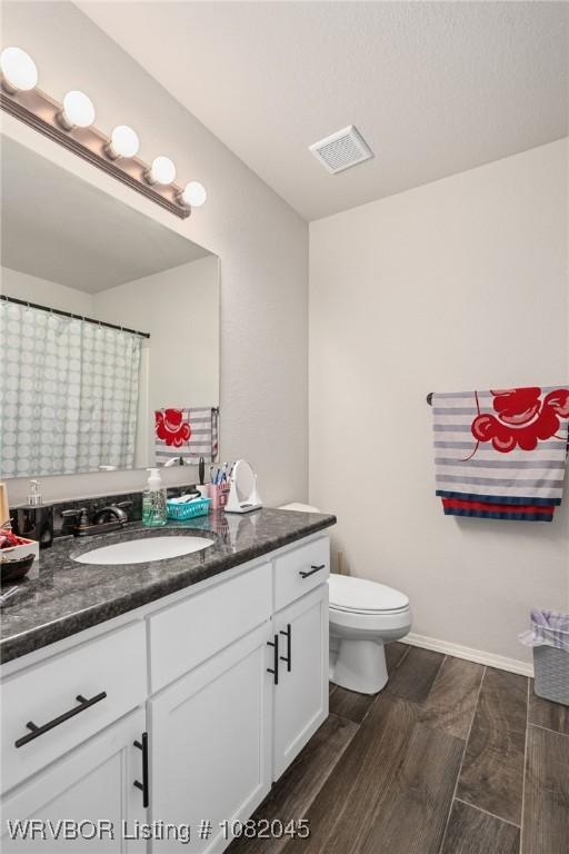 1138 Delta Dr, Van Buren, AR 72956 - bathroom with vanity and wood finished floors