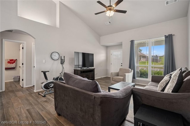 1138 Delta Dr, Van Buren, AR 72956 - living room featuring arched walkways, high vaulted ceiling, ceiling fan, and dark wood-type flooring