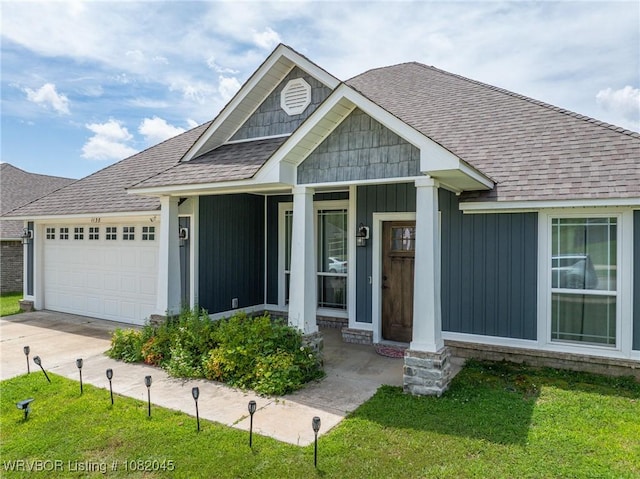 1138 Delta Dr, Van Buren, AR 72956 - view of front of property with roof with shingles, a garage, driveway, a front lawn, and a porch