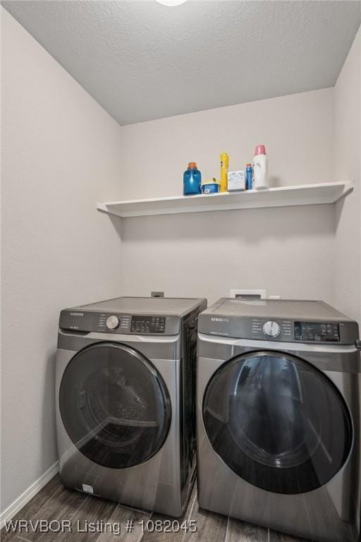 1138 Delta Dr, Van Buren, AR 72956 - laundry room with separate washer and dryer, wood finished floors, and a textured ceiling