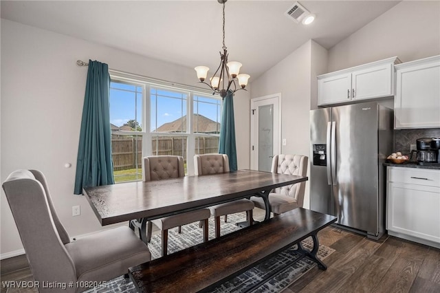 1138 Delta Dr, Van Buren, AR 72956 - dining space with vaulted ceiling, dark wood-style floors, and a chandelier