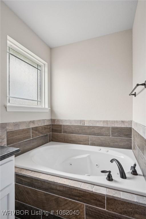 1138 Delta Dr, Van Buren, AR 72956 - bathroom with a jetted tub and vanity