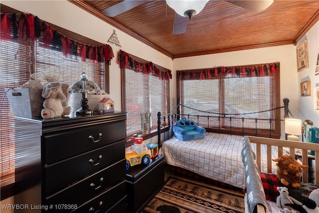 bedroom with ceiling fan, crown molding, and wooden ceiling